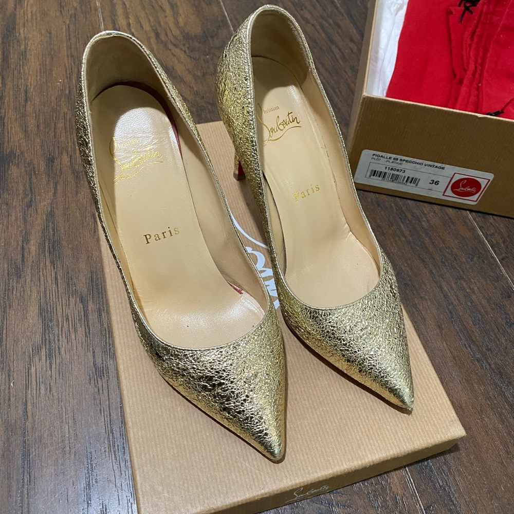 Christian Louboutin gold heels